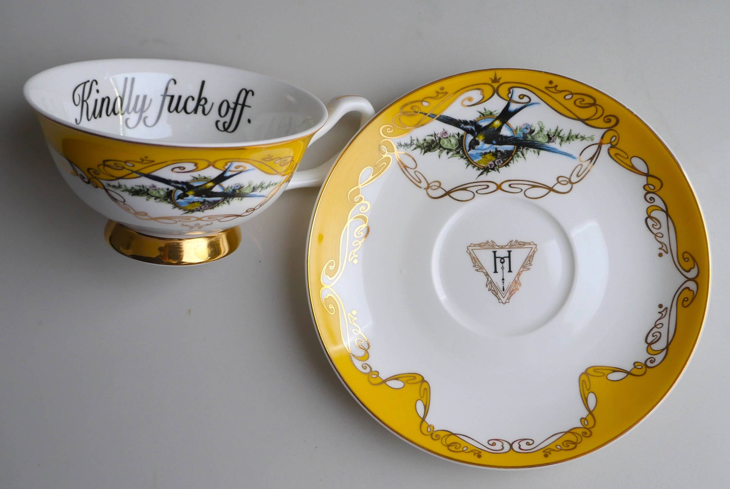 Yellow bird insult teacup and saucer: Kindly fuck off