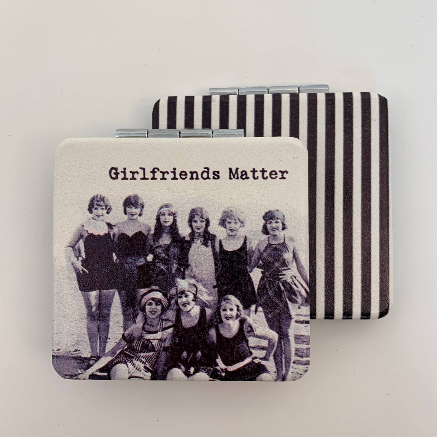 Compact mirror girlfriends matter on beach